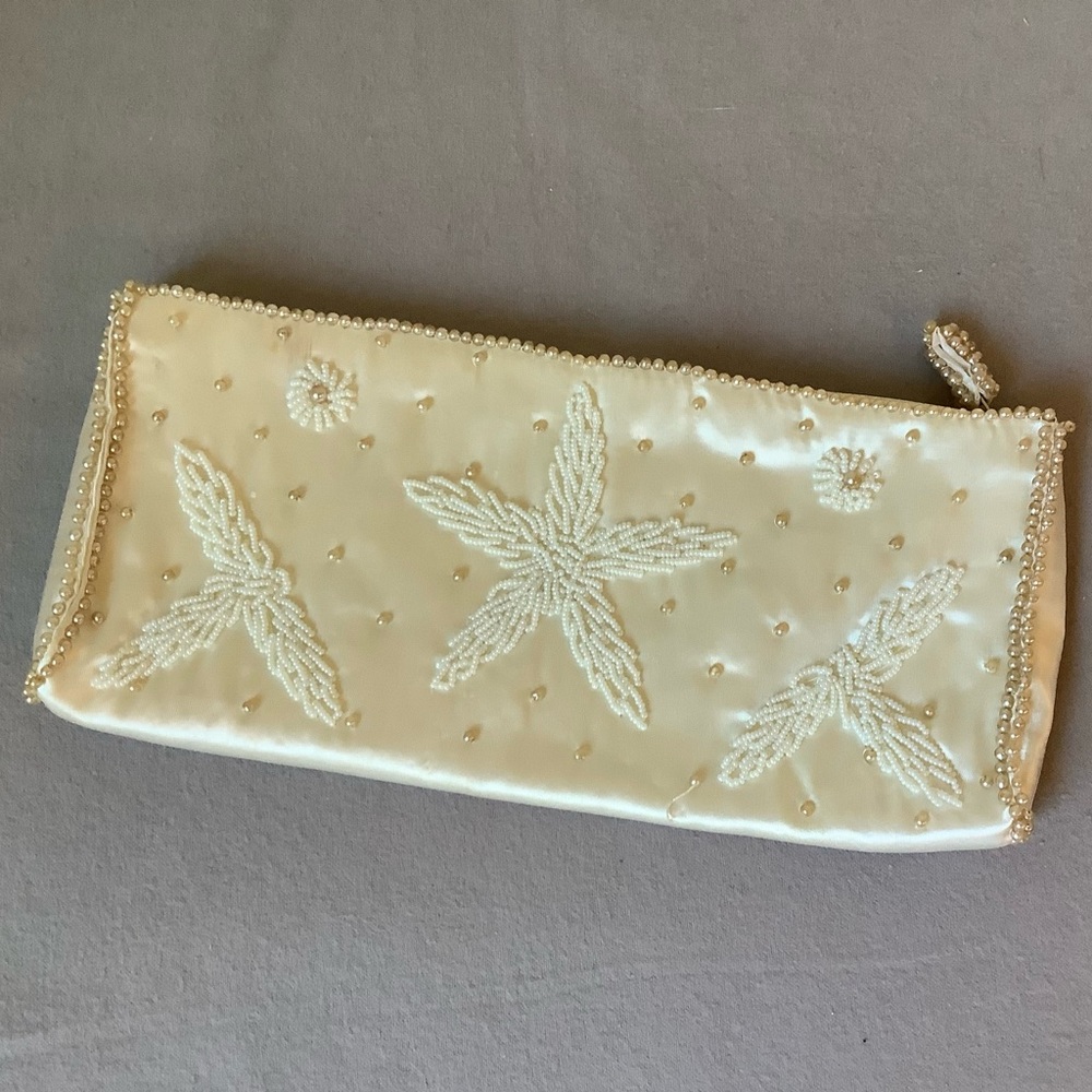 Vintage silk purse with hand sewn pearl beading 9.5” x 4” with zip closure.